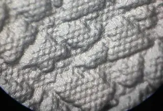 Small pits on the surface of the product reducing the gloss of the product