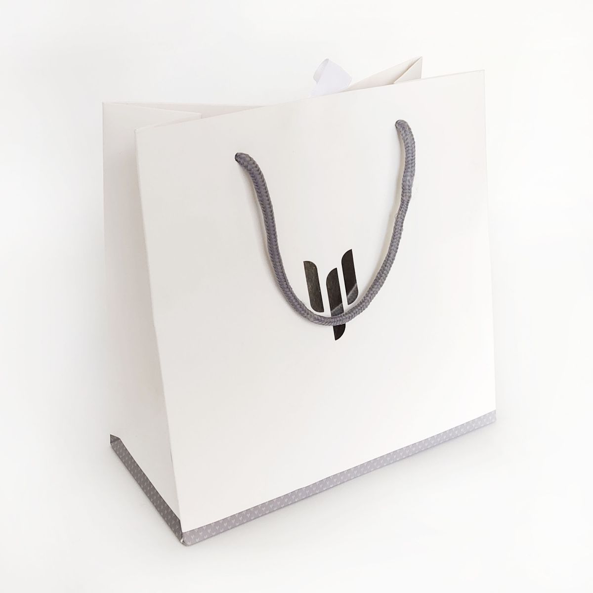 white gift bags with rope handles