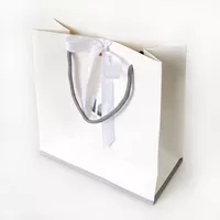 white gift bags with rope handles