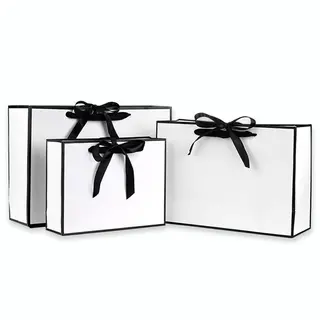 white paper bags with string handles