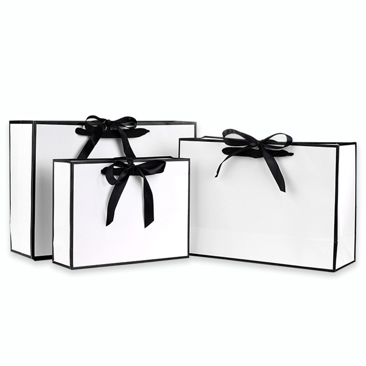 white paper bags with string handles