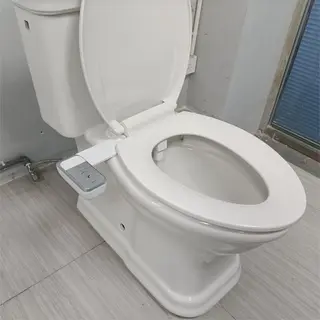 Bidet attachment adjustable nozzle