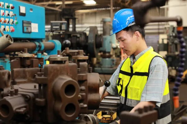 An Engineer Inspects Machinery