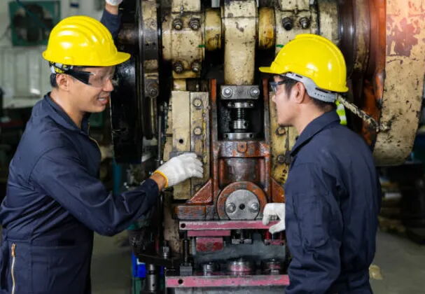 Technician Working on Machine