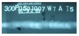 RT film showing abnormal dark regions